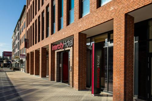 a brick building with a sign on the side of it at IntercityHotel Hamburg-Barmbek in Hamburg