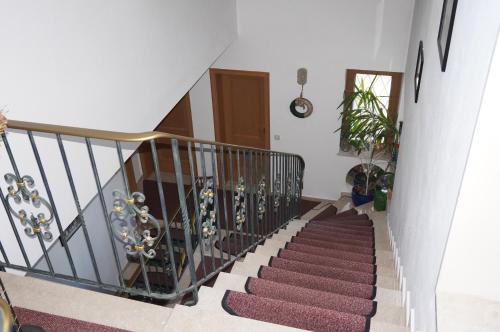 a staircase in a house with a stair case at Gästehaus Brigitte in Garmisch-Partenkirchen