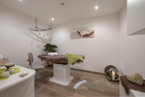 a kitchen with a table in a room at Naturhotel Runa in Rodengo