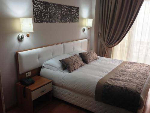 Ein Bett oder Betten in einem Zimmer der Unterkunft Hotel Arvi