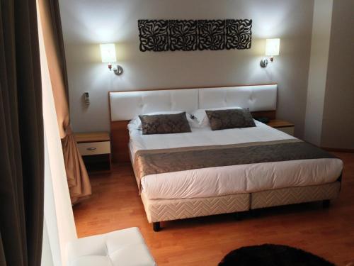 Ein Bett oder Betten in einem Zimmer der Unterkunft Hotel Arvi