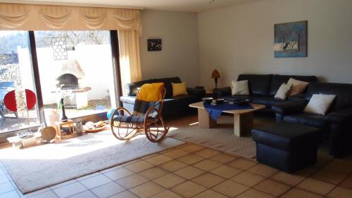 a living room with a couch and a table at WenneGlück in Meschede