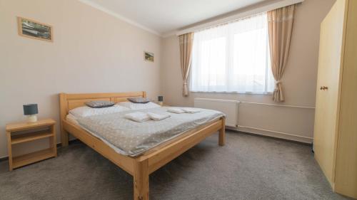 Postel nebo postele na pokoji v ubytování Apartmány U Sjezdovky