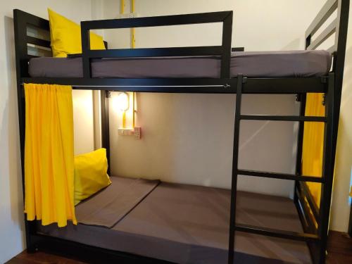 a couple of bunk beds in a room at Best Bed Suvarnabhumi Hostel in Lat Krabang