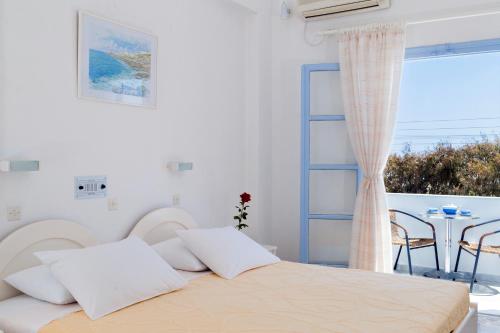Postel nebo postele na pokoji v ubytování Areti Hotel