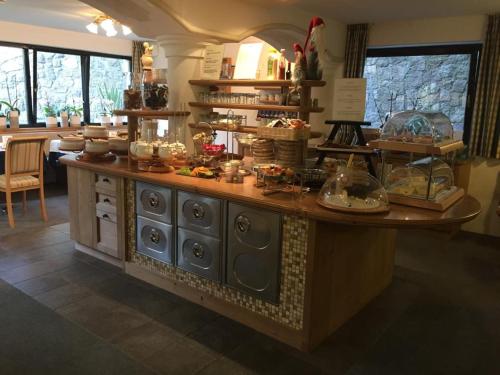 a kitchen with a counter with dishes on it at Garni Residence Trocker in Castelrotto