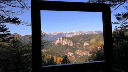 a view of a mountain range from a window at Landhaus Semmering in Semmering