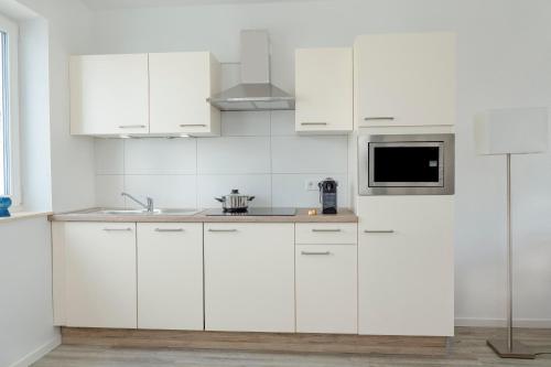 Η κουζίνα ή μικρή κουζίνα στο Boardinghouse Living28 Kaarst