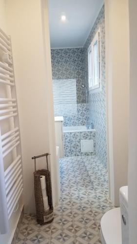 Ένα μπάνιο στο Appart'hotel de la Mairie