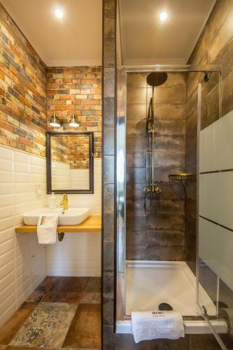 a bathroom with a shower and a sink at Central Dayflat Apartments in Kyiv