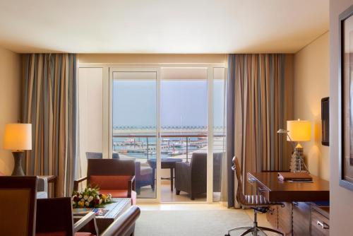a hotel room with a view of the ocean at Barceló Mussanah Resort, Sultanate of Oman in Mussanah
