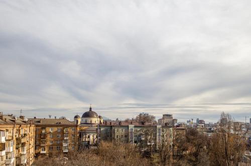 a view of a city with buildings and a dome at Secret Apartments in Kyiv