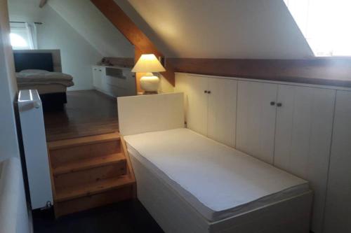 Katil atau katil-katil dalam bilik di Vakantiehoeve De Klepperij
