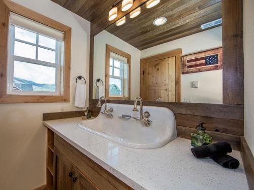 a bathroom with a sink and a large mirror at Rendezvous #20 in Chelan