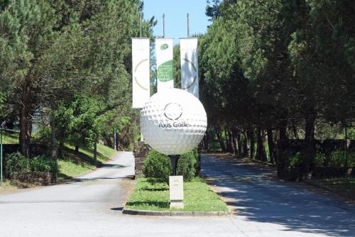a large white golf ball on display in a park at Golf Course - Luxurious Flat T3 - Ponte de Lima in Ponte de Lima
