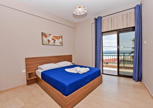 Ліжко або ліжка в номері Alexandros SeaView Suites