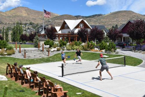 a group of people playing tennis on a tennis court at Brass Monkey #74 in Chelan