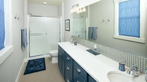 a bathroom with a sink and a toilet and a mirror at Happy Hours #26 in Chelan