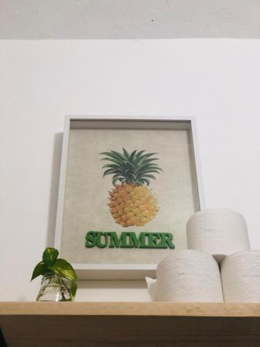 a picture of a pineapple on top of a shelf at Refugio del Cielo # in Sayulita