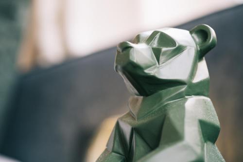a green and silver figurine of a dog at Getaway Studios Gent in Ghent