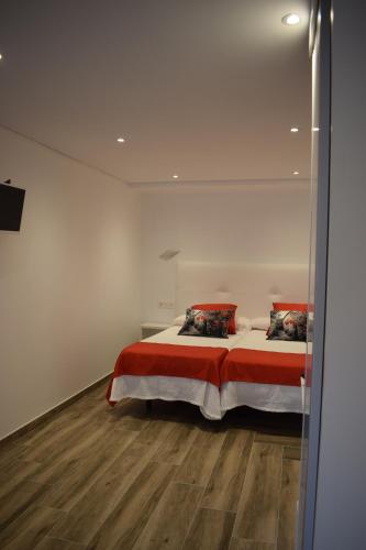 Ένα ή περισσότερα κρεβάτια σε δωμάτιο στο Hotel Restaurante Racha