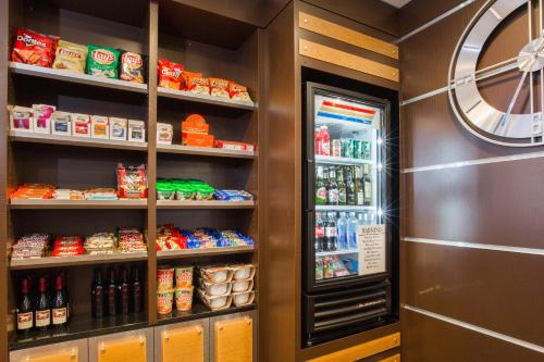 a refrigerator in a store with food and drinks at Holiday Inn Express Mountain View South Palo Alto by IHG in Mountain View