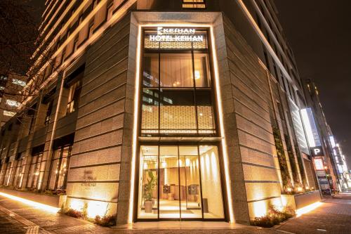 a building with a sign on the side of it at Hotel Keihan Nagoya in Nagoya
