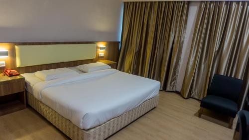 Кровать или кровати в номере Hotel Samila