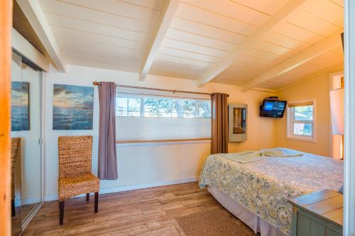 a bedroom with a bed and a window at Surfscape Beach House, Private Beach & Ocean views in Bodega Bay
