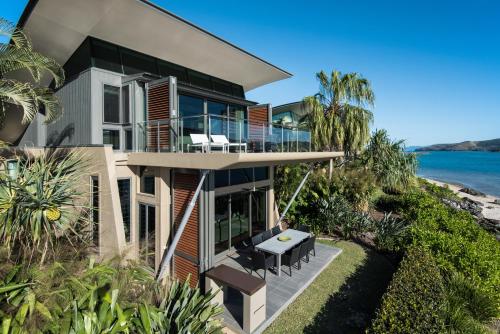 an aerial view of a house with a balcony at Yacht Club Villas on Hamilton Island by HIHA in Hamilton Island