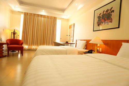 Ένα ή περισσότερα κρεβάτια σε δωμάτιο στο Semec Hotel Nghi Son