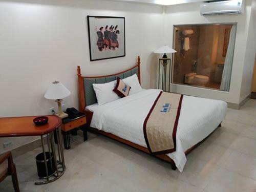 Ένα ή περισσότερα κρεβάτια σε δωμάτιο στο Semec Hotel Nghi Son
