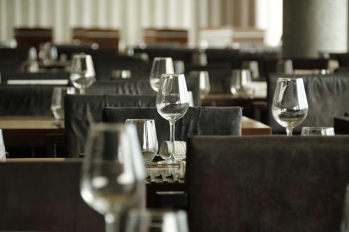 a group of wine glasses sitting on a table at Penafiel Park Hotel & Spa in Penafiel
