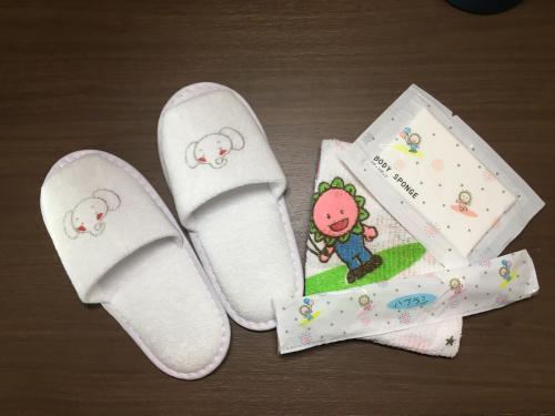 a pair of white socks with a hello kitty book at Hotel Metropolitan Nagano in Nagano