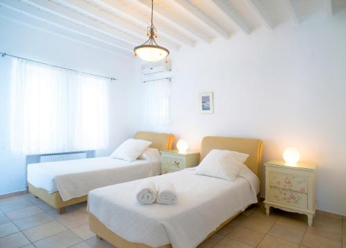 Cama ou camas em um quarto em Aeri Villas & Apartments
