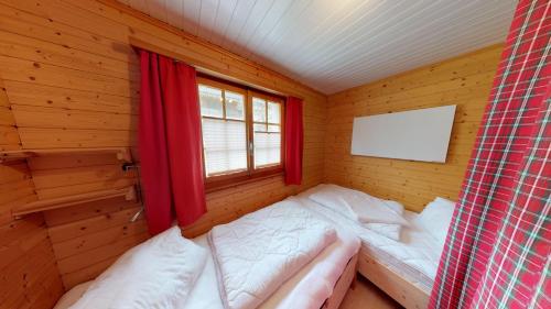 Ein Bett oder Betten in einem Zimmer der Unterkunft Ilse