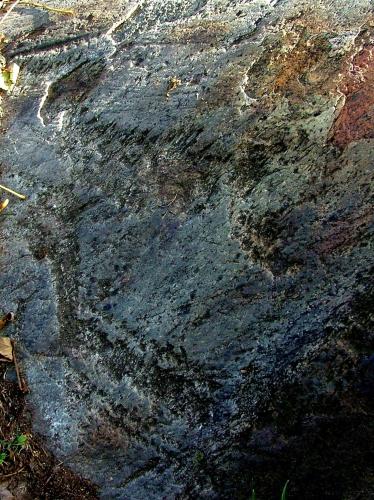 a rock with a painting of a person on it at B&B Il Pettirosso in Malonno