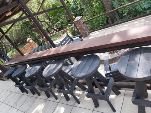 a group of chairs sitting under a picnic table at Peace@Kruger in Marloth Park