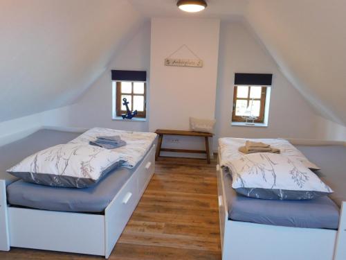 Cama o camas de una habitación en Ferienhaus Anno1875