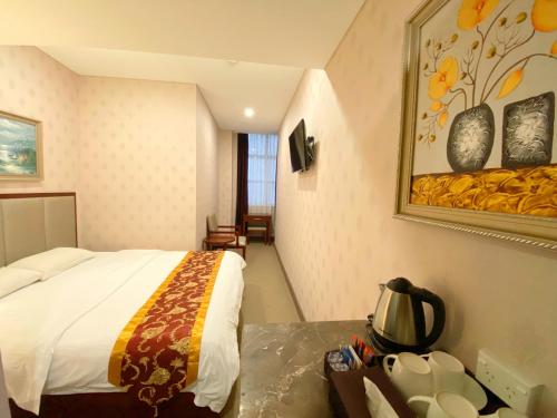 Un ou plusieurs lits dans un hébergement de l'établissement Megaboom City Hotel