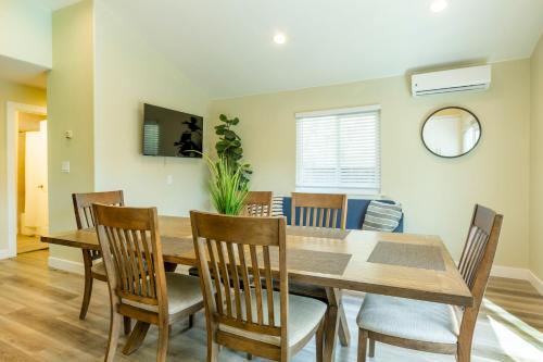 a dining room with a wooden table and chairs at @ Marbella Lane 6BR Duplex in Downtown San Jose in San Jose