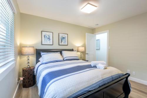 a bedroom with a large bed with two pillows at @ Marbella Lane 6BR Duplex in Downtown San Jose in San Jose
