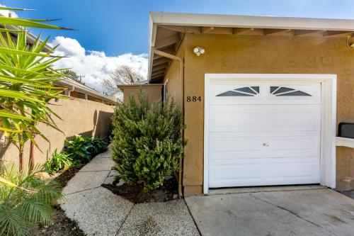 a white garage door in front of a house at @ Marbella Lane 6BR Duplex in Downtown San Jose in San Jose