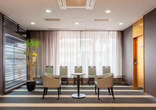 a conference room with a table and chairs at APA Hotel Saga Ekimae Chuo in Saga