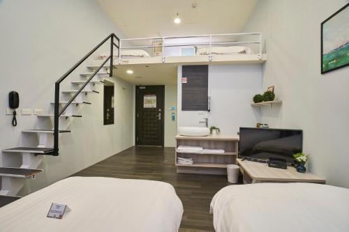 Postel nebo postele na pokoji v ubytování Place‧X Hotel