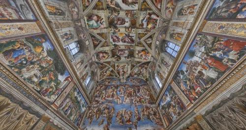 a ceiling with paintings on the ceilings of a building at Roma Resort Colosseum in Rome