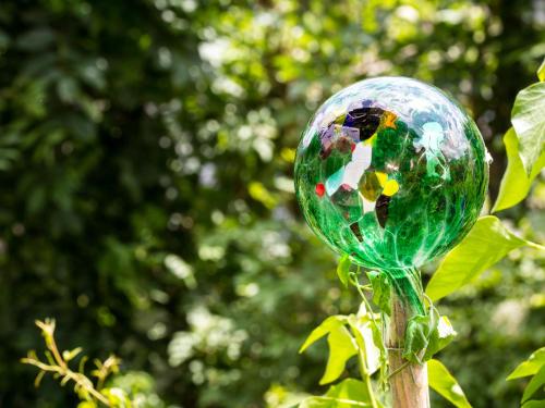 a glass ball sitting on top of a tree branch at Landhaus Albrecht in Mittenwald