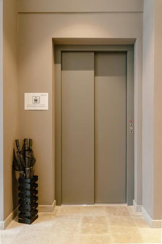 a corridor with two elevators in a building at Hotel Johanns in Hilpoltstein