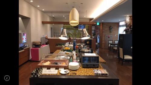 a kitchen with a counter top in a room at Hotel Crown Hills Kamaishi in Kamaishi
