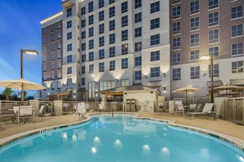 a swimming pool in front of a building at Staybridge Suites - Florence Center by IHG in Florence